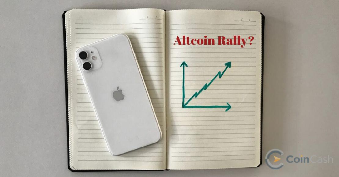 Iphone 11 egy füzeten amire altcoin rally van írva.